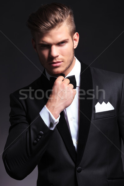 business man adjusting his bow tie Stock photo © feedough