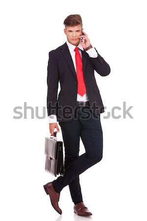 Homme d'affaires jambes croisées photos jeunes permanent [[stock_photo]] © feedough