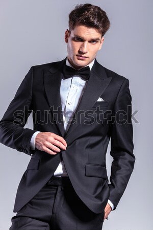 young business man looks at you with hand in pocket Stock photo © feedough