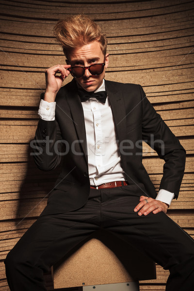 Elegant blond business man taking off his sunglasses. Stock photo © feedough