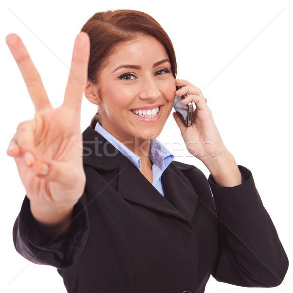 woman with phone and victory gesture Stock photo © feedough