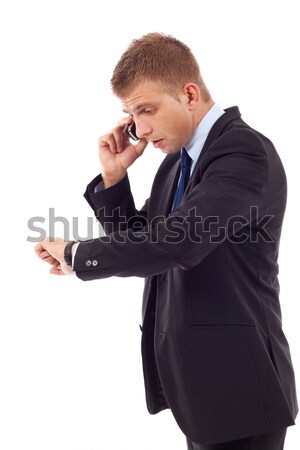 Idő fiatal üzletember beszél mobiltelefon üzlet Stock fotó © feedough