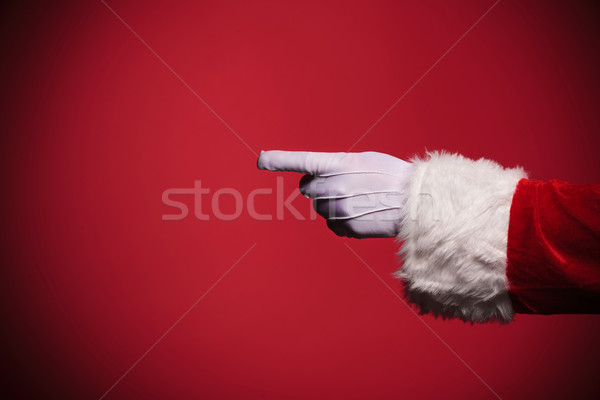 Santa Claus gloved hand pointing finger Stock photo © feedough