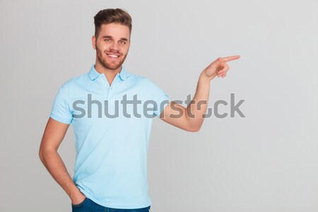 smiling casual man inviting  Stock photo © feedough