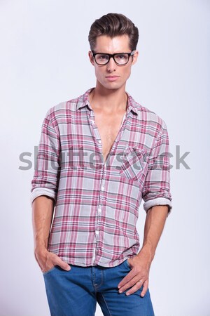 young man walking with hand in back pocket Stock photo © feedough