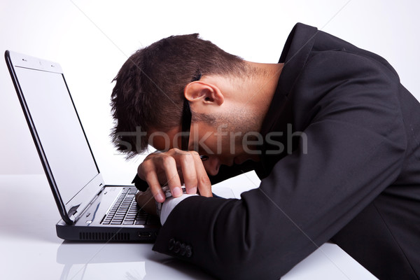 Tired business man sleeping on laptop Stock photo © feedough