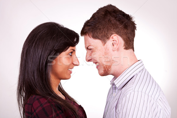 portrait of a young boy making faces to amuse his girl Stock photo © feedough