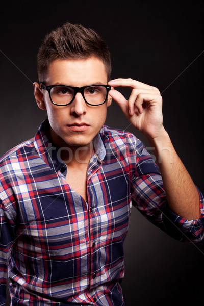 young casual man putting on his sunglasses Stock photo © feedough