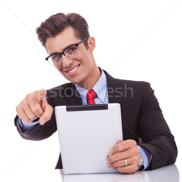 Stock photo: business man choosing you while reading on tablet