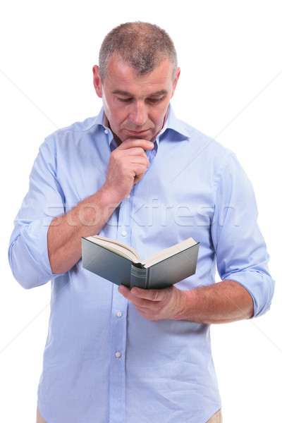 casual middle aged man reading attentive Stock photo © feedough