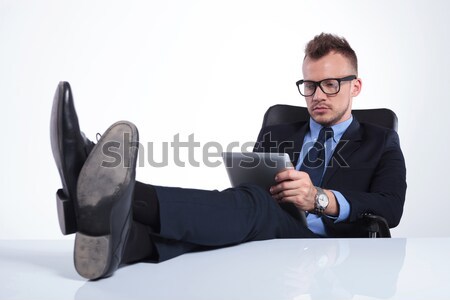business man relaxes with tablet in hand Stock photo © feedough