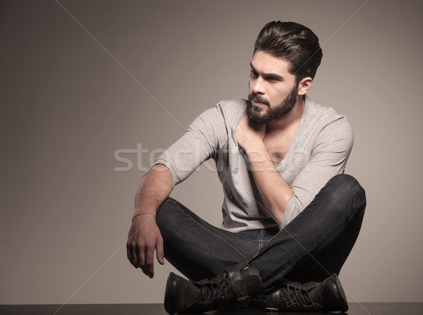 seated fashion man looking to his side Stock photo © feedough