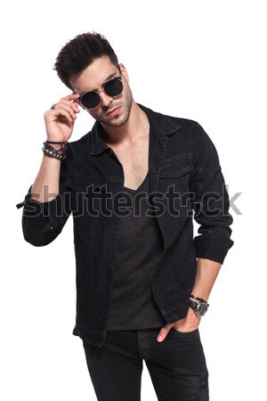 macho man in black clothes fixing his sunglasses Stock photo © feedough