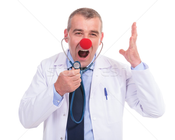 Stock photo: phony doctor screaming in his stethoscope