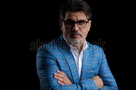 young man wearing glasses while thinking and posing  Stock photo © feedough