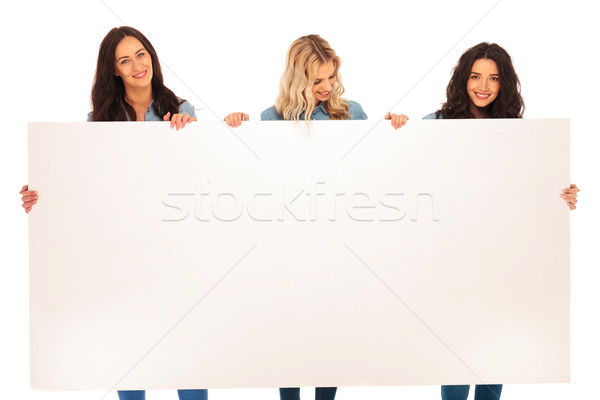 Tre donne amici cartellone sorriso Foto d'archivio © feedough