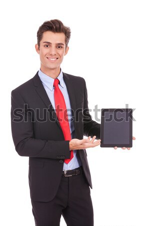 smiling business man showing you his tablet pad Stock photo © feedough