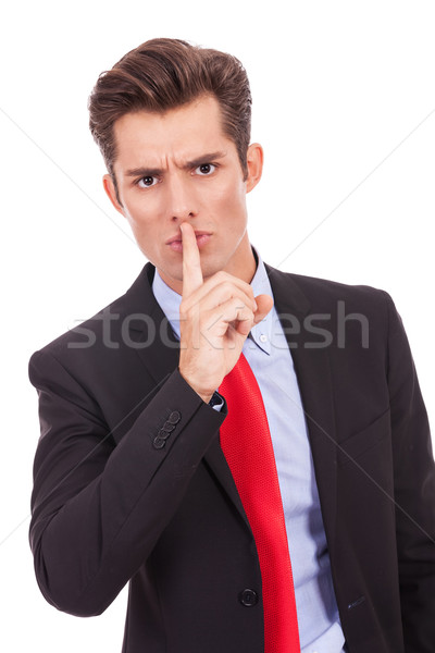 Csendes üzletember ujj ajkak készít kézmozdulat Stock fotó © feedough