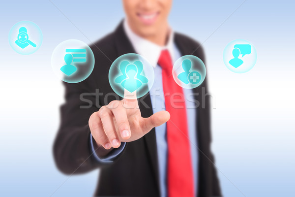 Stock photo: business man hand pressing social network icon