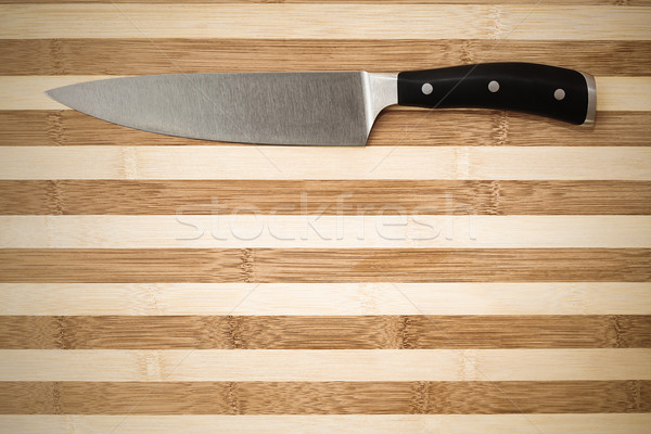 20 cm chef's knife on a bamboo cutting board  Stock photo © feedough