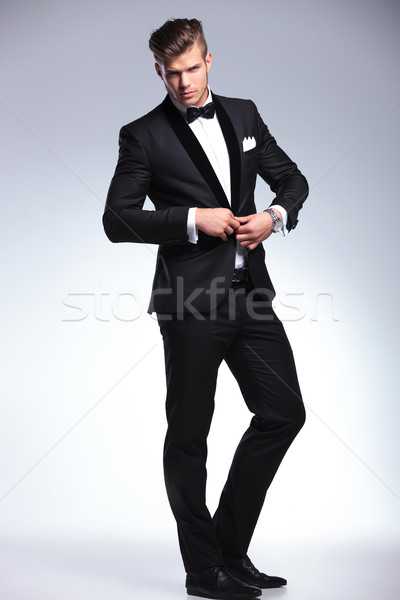 business man buttoning up Stock photo © feedough