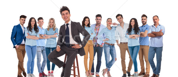 businessman leader of casual team sitting on chair in front Stock photo © feedough