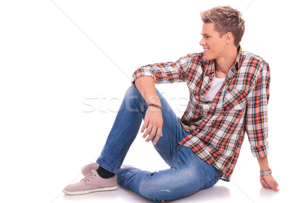seated casual man looking to side Stock photo © feedough