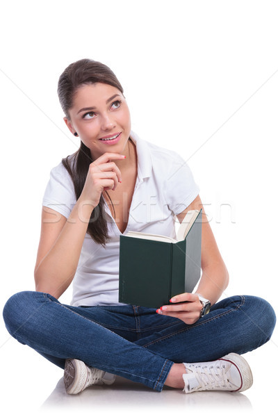 casual woman sits & reads & thinks Stock photo © feedough