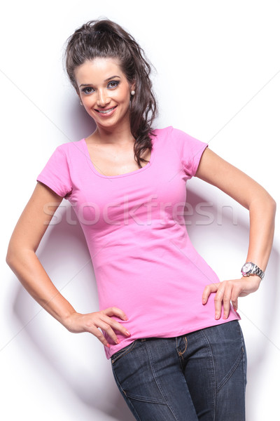 Souriant femme permanent mains hanches [[stock_photo]] © feedough