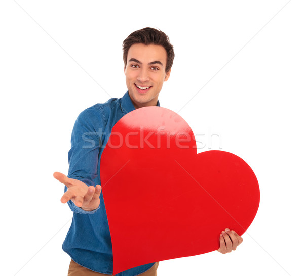 smiling young casual man inviting you to love him Stock photo © feedough