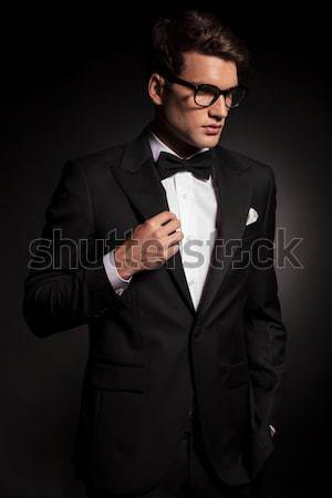 elegant business man closing his jacket  Stock photo © feedough