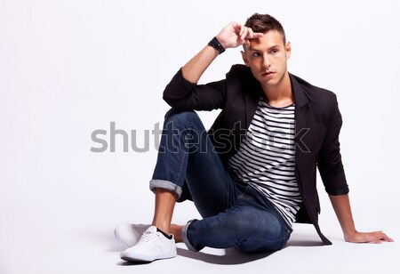 Young casual man sitting on the floor  Stock photo © feedough