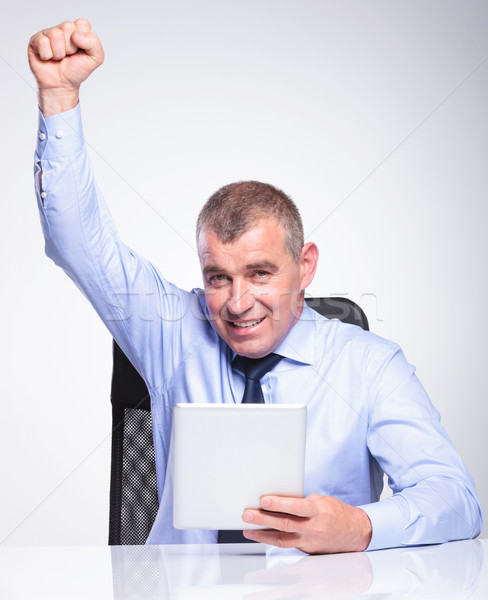 old business man with tablet cheers Stock photo © feedough
