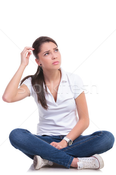 Frau verwirrt Sitzung Beine gekreuzt Stock foto © feedough