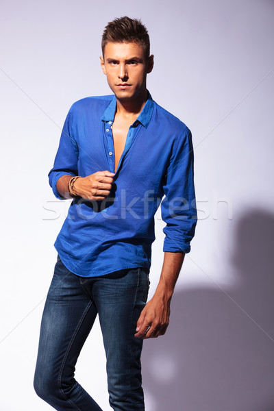 Tough young casual man posing with a serious look on his face, looking at the camera, on light backg Stock photo © feedough