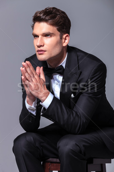 Człowiek biznesu trzymając się za ręce wraz modląc widok z boku posiedzenia Zdjęcia stock © feedough