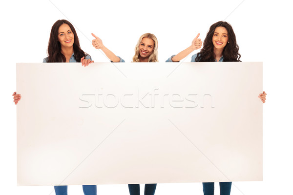 3  women recommend what they  show you on  big  board Stock photo © feedough