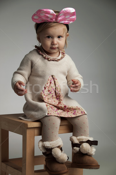 girl wears knitted dress, furry boots and pink bow headband  Stock photo © feedough