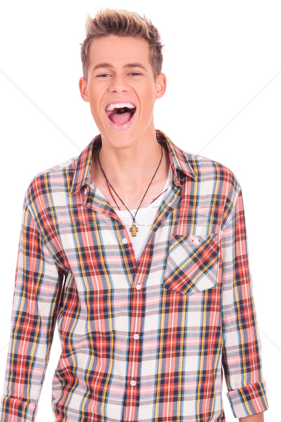 örömteli fiatalember kiabál derék felfelé portré Stock fotó © feedough