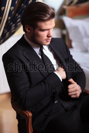 fashion man in tuxedo and bow tie blowing his smoke Stock photo © feedough