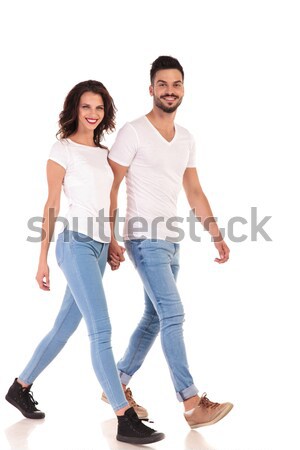Jeunes heureux couple marche mains tenant [[stock_photo]] © feedough