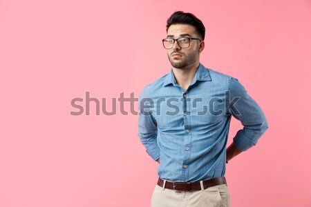 young fashion man with hands in back pockets among bubbles Stock photo © feedough