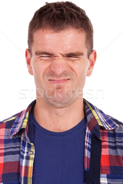 Fiatalember készít furcsa arc portré lezser Stock fotó © feedough