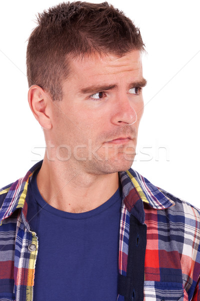 young man looking suspiciously to a side Stock photo © feedough