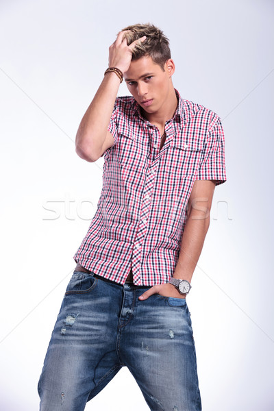 casual man adjusts his hair Stock photo © feedough