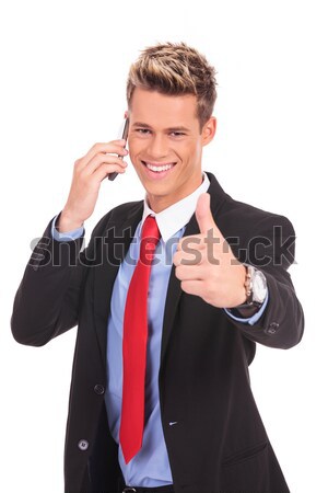 business man showing thumbs up on phone Stock photo © feedough