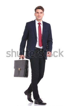 Side view of a young business man holding a brief case Stock photo © feedough