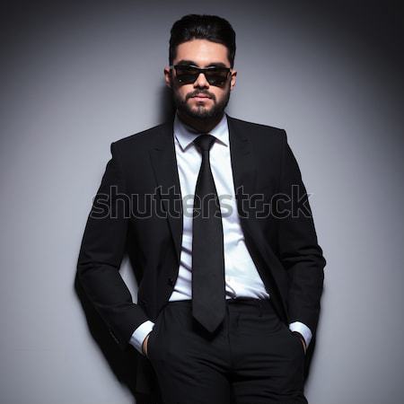 Stock photo: fashion business man in suit and tie is sitting