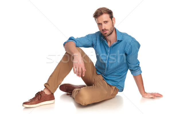 young casual man relaxing on the floor Stock photo © feedough