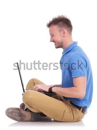 Stock photo: young man writes an sms